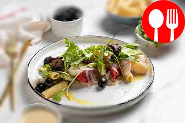 Italian salad with penne pasta, mozzarella, tomato and tuna