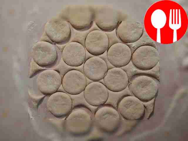 Dust the dough with flour and roll out a...