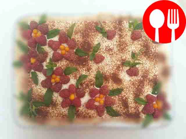 Decorate the tiramisu cake with raspberries on...