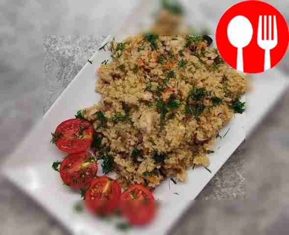 Bulgur with chicken and mushrooms in a frying pan