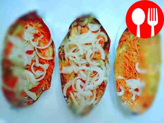 Place vegetables in layers in prepared boats....