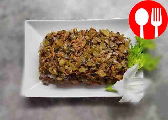 Delicious herring salad with mushrooms