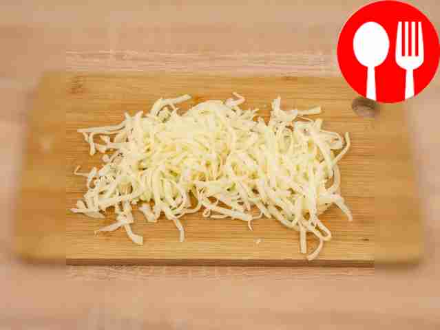 Grate the cheese on a coarse grater.