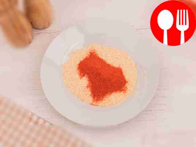 In another bowl, mix breadcrumbs and paprika.