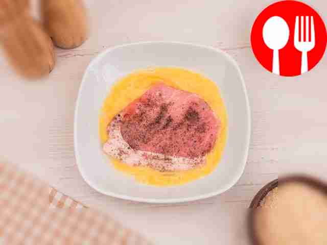 Dip each pork chop in the egg.