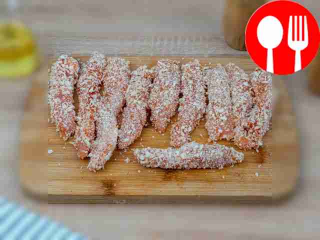 Coat each piece of chicken in breadcrumbs.