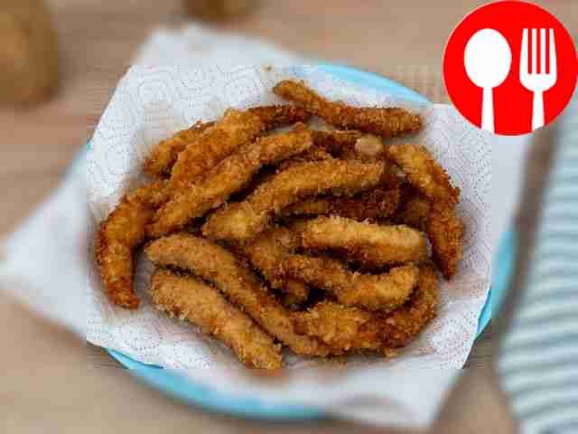 Place cooked nuggets on paper towels to remove...
