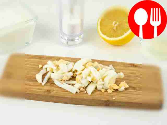 Cut the eggs into small strips or pass them...