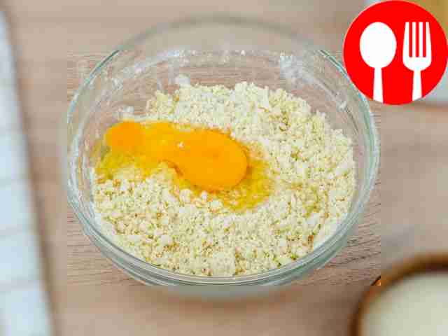 Add a chicken egg to the butter-flour crumbs....