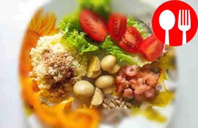 Colorful bowl with couscous and shrimp