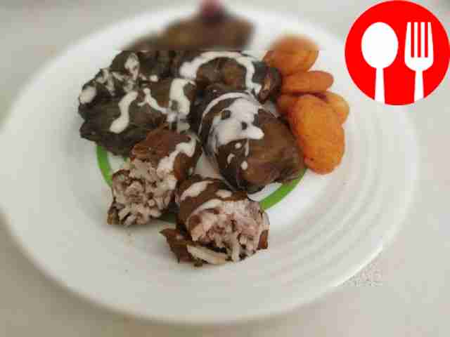 Serve the dolma on a large platter. Place a...