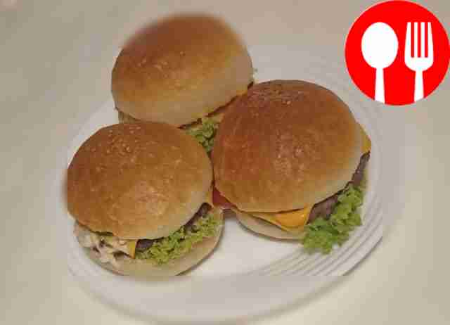 Serve the burgers garnished with herbs. Place...