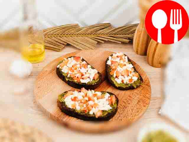 Bruschetta with black bread and pesto