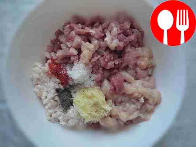 Take pre-cut pork and chicken. Add garlic and...