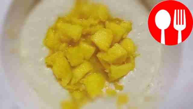 Combine the dough with mango and stir. Line...