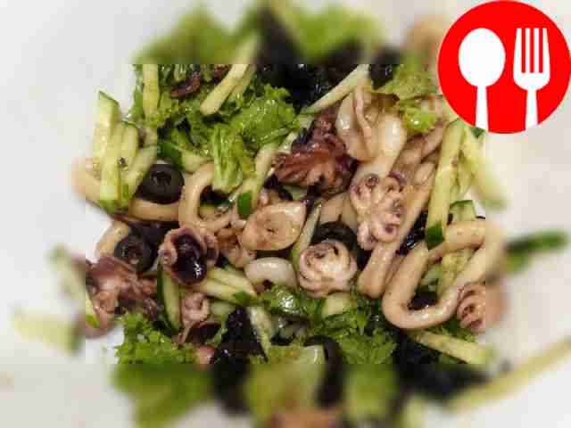 Delicious octopus and squid with olives and vegetables