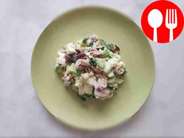 Original salad with baby octopus, eggs and cucumbers