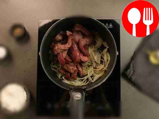 Cut the meat into long strips, then cut them...