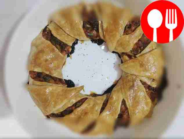 Serve the pie in portions. Garnish with basil...