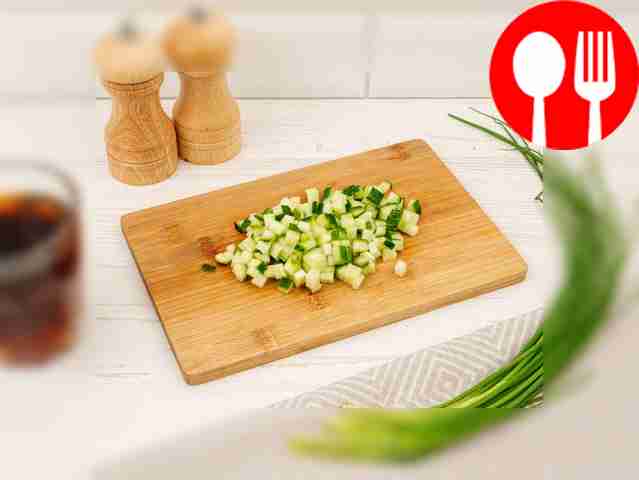 Cut boiled potatoes, cucumbers, sausage,...