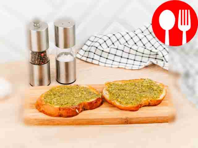 Spread Pesto sauce onto toasted bread.