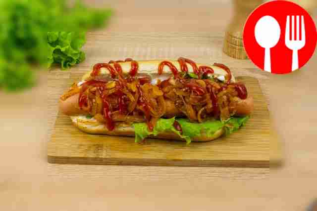 Top the hot dogs with ketchup.