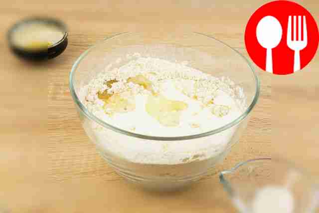 Pour kefir and vegetable oil into the dry ingredients.