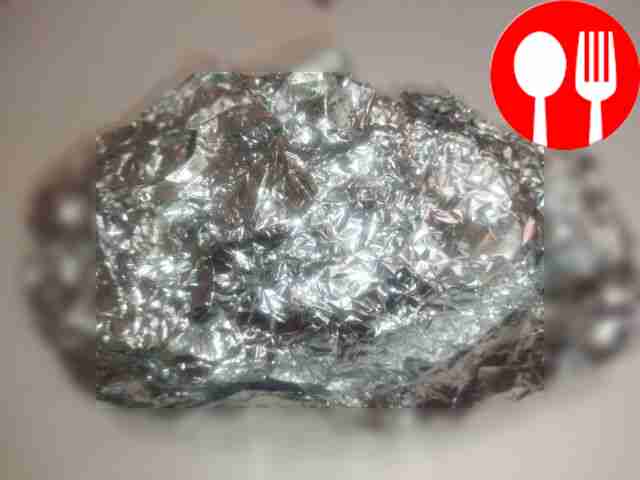 Fold a large piece of foil in half and place...