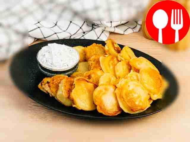 Potatoes in batter with sour cream sauce