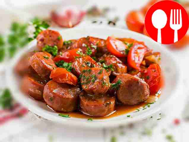 Sausages fried with tomato and onion
